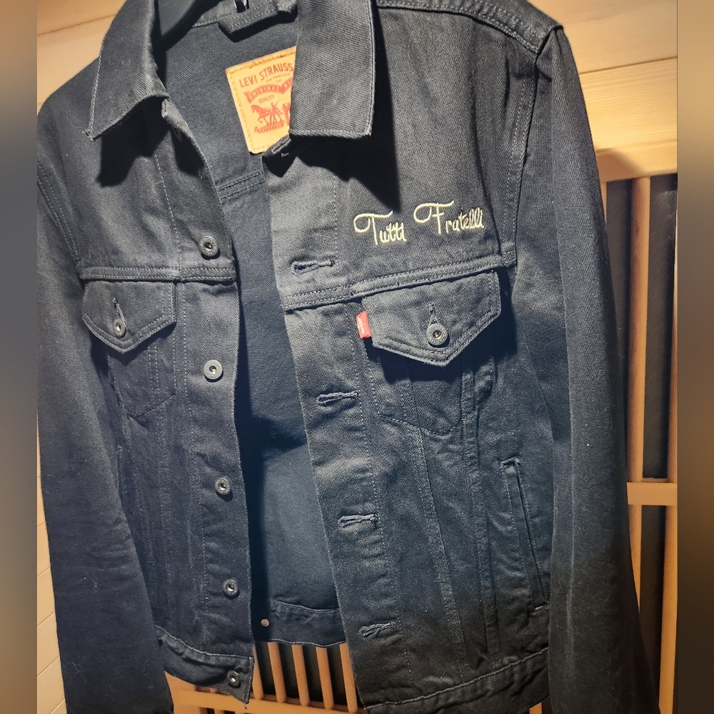 NWOT Levi's black Jean jacket, with Fratelli Tutti signature.